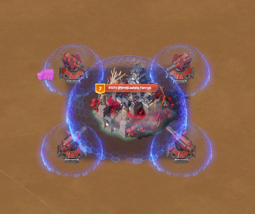 Top-down view of the Season 4 Evernight Isle warzone capitol with cannons and shields in Last War: Survival